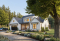 Vue avant - MODÈLE DE BASE - Plan maison Farmhouse 4 chambres, garage triple, îlot, garde-manger, foyer, suite des parents au premier - Greenhills 2