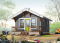 Vue avant - MODÈLE DE BASE - Plan de petit mini chalet 1 chambre, aire ouverte, économique, poêle à bois, petit balcon avant - Le Gîte