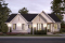Vue avant - MODÈLE DE BASE - Plan de maison bi-génération plain-pied, 1+3 chambres, terrasse abritée, 2 foyers côté famille  - Angéline