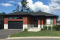 Vue avant - MODÈLE DE BASE - Plan de plain-pied moderne 2 chambres, garage, cuisine avec grand îlot, buanderie au rez-de-chaussée - Darma