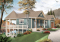 Vue avant - MODÈLE DE BASE - Plan de chalet avec grande terrasse, 2 garages, 2 salons, 3 chambres, chambre des maîtres au r-d-c - Terrasson 4