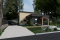 Version couleur no. 1 - Vue avant - Maison moderne cubique avec garage pour motorisé et plusieurs options d'aménagement intérieur - Halte