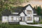 Version couleur no. 1 - Vue avant - Plan de grande maison 4 chambres, garage double + bureau, 2 chambres avec salle bain privée - Goldbourn