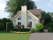 Vue avant - MODÈLE DE BASE - Plan de cottage d'une chambre en mezzanine, cuisine avec îlot et garde-manger, vestiaire - Larchmont 2