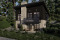 Vue avant - MODÈLE DE BASE - Plan de chalet moderne rustique – plan lumineux avec foyer central, 3 chambres et sous-sol modulable - Lombard