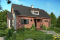 Vue avant - MODÈLE DE BASE - Maison de style fermette moderne à aire ouverte avec foyer, cuisine avec îlot, salle de bain privé aux parents - Magnolia 2
