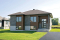 Vue avant - MODÈLE DE BASE - Plan de bungalow de type split-level contemporain, 2 chambres, aire ouverte, sous-sol aménageable,  - Hautbois 3